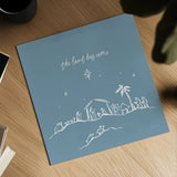 Simple Nativity II Blue by Jenaya Jackson. Shown as a detailed flat fine art print, highlighting archival giclee quality. Available as an archival giclee rolled canvas, fine art paper, or poster print. SKU 102003a.