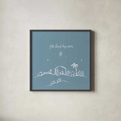 Simple Nativity II Blue by Jenaya Jackson. Shown in a sleek black glass frame for a contemporary gallery look. Available as an archival giclee rolled canvas, fine art paper, or poster print. SKU 102003a.