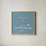 Simple Nativity II Blue by Jenaya Jackson. Shown in a natural wood glass frame for a timeless modern aesthetic. Available as an archival giclee rolled canvas, fine art paper, or poster print. SKU 102003a.
