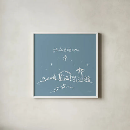 Simple Nativity II Blue by Jenaya Jackson. Shown in a crisp white glass frame for a clean and minimalist style. Available as an archival giclee rolled canvas, fine art paper, or poster print. SKU 102003a.