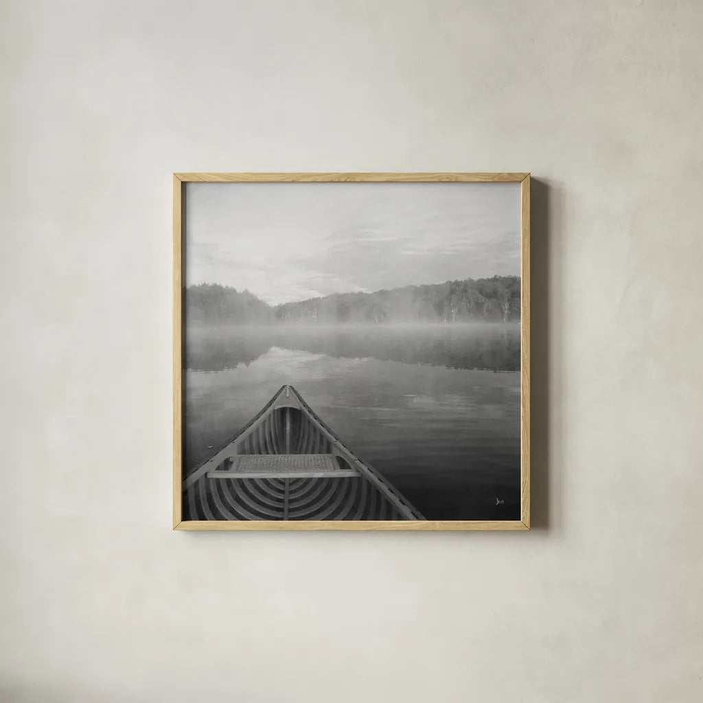 Calm Waters Canoe I BW by Jess Aiken. Shown in a natural wood glass frame for a timeless modern aesthetic. Available as an archival giclee rolled canvas, fine art paper, or poster print. SKU 83655a.