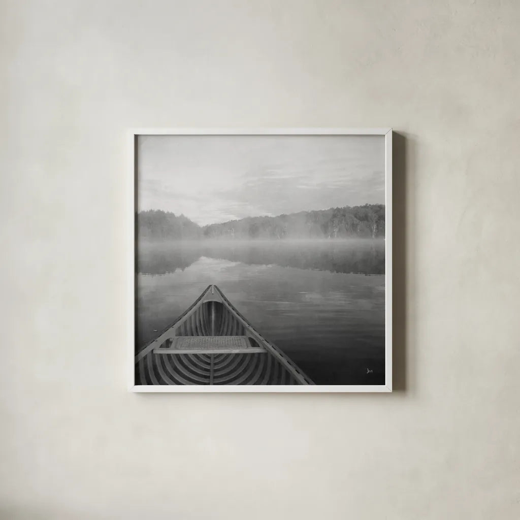 Calm Waters Canoe I BW by Jess Aiken. Shown in a crisp white glass frame for a clean and minimalist style. Available as an archival giclee rolled canvas, fine art paper, or poster print. SKU 83655a.