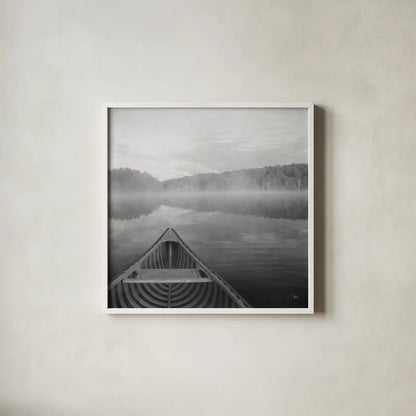 Calm Waters Canoe I BW by Jess Aiken. Shown in a crisp white glass frame for a clean and minimalist style. Available as an archival giclee rolled canvas, fine art paper, or poster print. SKU 83655a.