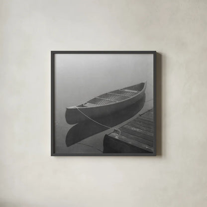 Calm Waters Canoe II BW by Jess Aiken. Shown in a sleek black glass frame for a contemporary gallery look. Available as an archival giclee rolled canvas, fine art paper, or poster print. SKU 83656a.