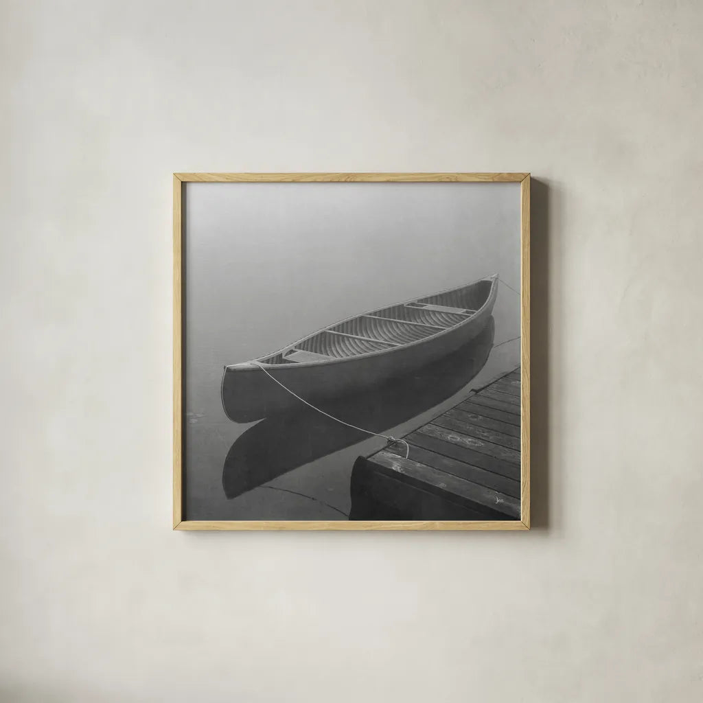 Calm Waters Canoe II BW by Jess Aiken. Shown in a natural wood glass frame for a timeless modern aesthetic. Available as an archival giclee rolled canvas, fine art paper, or poster print. SKU 83656a.