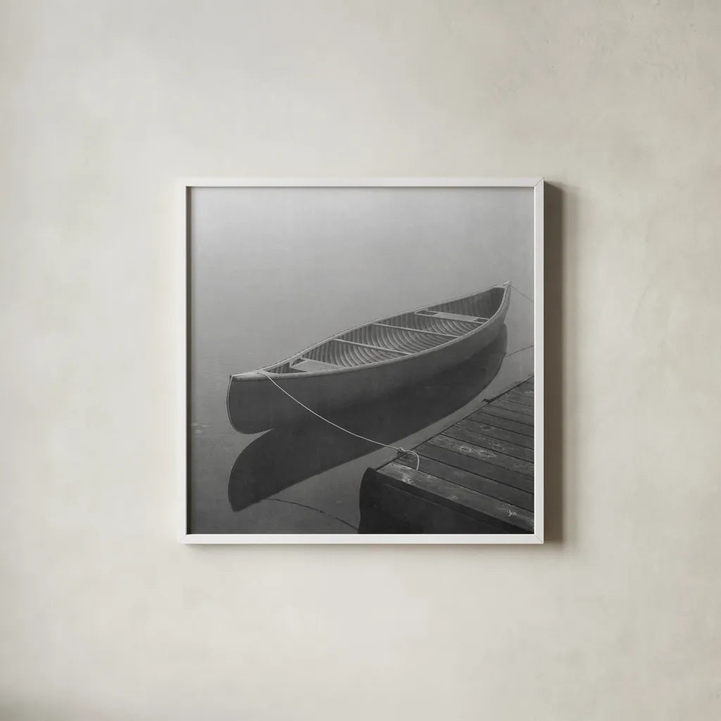 Calm Waters Canoe II BW by Jess Aiken. Shown in a crisp white glass frame for a clean and minimalist style. Available as an archival giclee rolled canvas, fine art paper, or poster print. SKU 83656a.