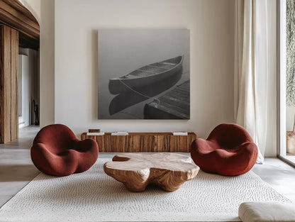 Calm Waters Canoe II BW by Jess Aiken. Shown as extra-large giant wall art in a modern living room. Available as an archival giclee rolled canvas, fine art paper, or poster print. SKU 83656a.