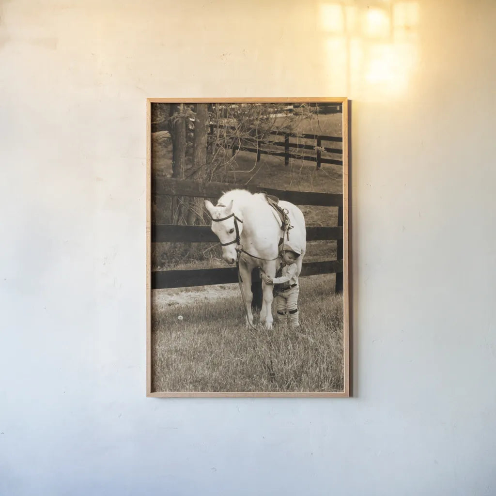 Pony Boy by Jim Dratfield. shown as a paper print in a natural frame. Available as a archival giclee rolled canvas, fine art paper, or poster print. SKU 16972h.