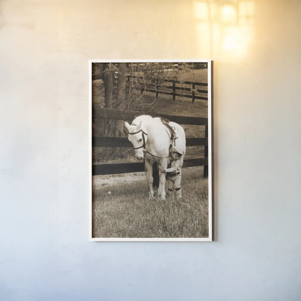 Pony Boy by Jim Dratfield. shown as a paper print in a white frame. Available as a archival giclee rolled canvas, fine art paper, or poster print. SKU 16972h.