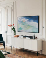 Distant Chateau by Jocelyn Elizabeth. shown as a framed stretched canvas in a living room above a console. Available as a archival giclee rolled canvas, fine art paper, or poster print. SKU 102099i.