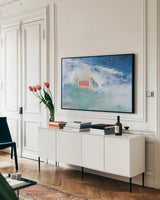 Distant Chateau Crop by Jocelyn Elizabeth. shown as a framed stretched canvas in a living room above a console. Available as a archival giclee rolled canvas, fine art paper, or poster print. SKU 102100i.