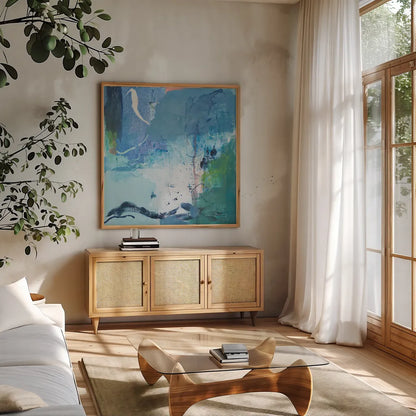Dive Into the Ocean II by Jocelyn Elizabeth. Shown in a natural wood frame in a cozy modern living room. Available as an archival giclee rolled canvas, fine art paper, or poster print. SKU 100329a.