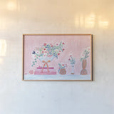 Flower Vases and Books Pink by Jocelyn Elizabeth. shown as a paper print in a natural frame. Available as a archival giclee rolled canvas, fine art paper, or poster print. SKU 100970i.