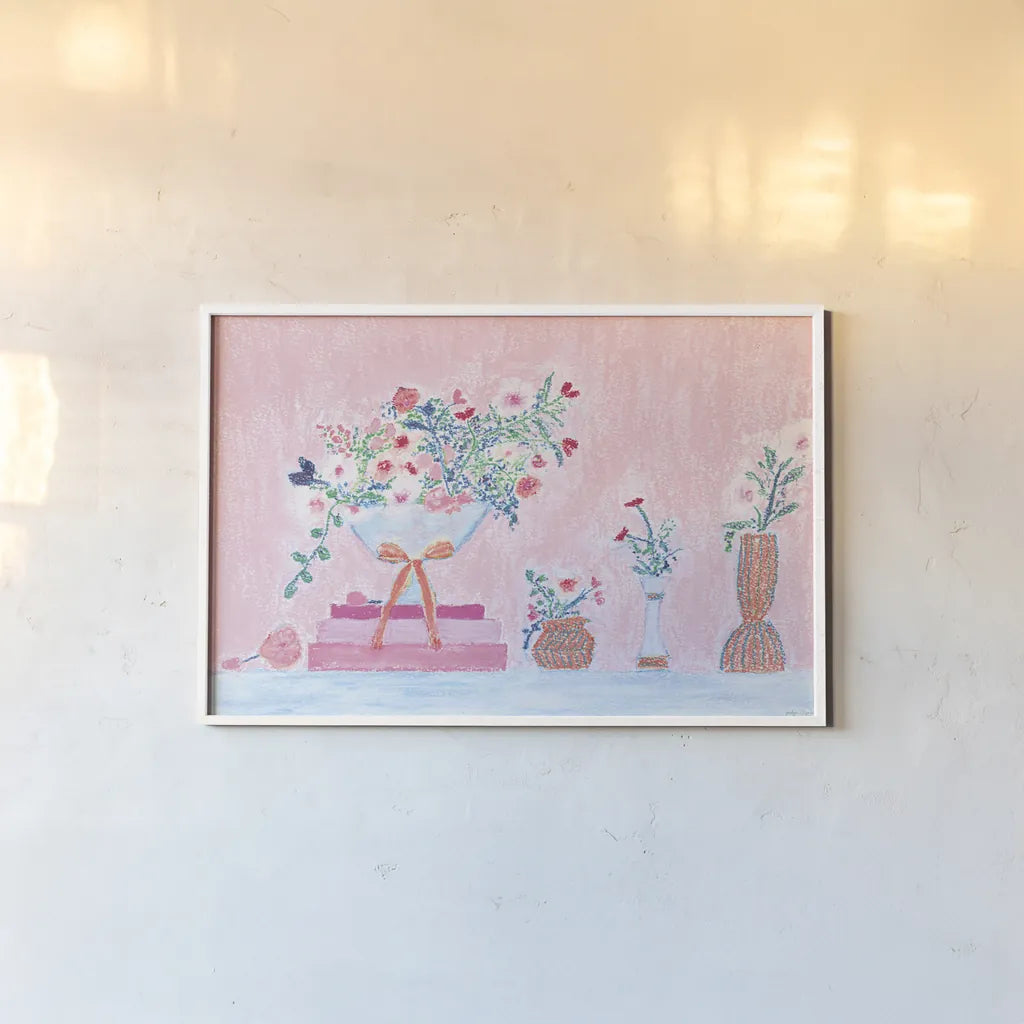 Flower Vases and Books Pink by Jocelyn Elizabeth. shown as a paper print in a white frame. Available as a archival giclee rolled canvas, fine art paper, or poster print. SKU 100970i.