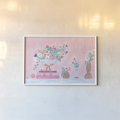 Flower Vases and Books Pink by Jocelyn Elizabeth. shown as a paper print in a white frame. Available as a archival giclee rolled canvas, fine art paper, or poster print. SKU 100970i.