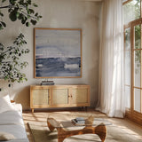 Grey Skies I by Jocelyn Elizabeth. Shown in a natural wood frame in a cozy modern living room. Available as an archival giclee rolled canvas, fine art paper, or poster print. SKU 100330a.