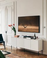 Heron in Flight by Jocelyn Elizabeth. shown as a framed stretched canvas in a living room above a console. Available as a archival giclee rolled canvas, fine art paper, or poster print. SKU 94029i.