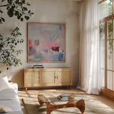 Keep It Between Us by Jocelyn Elizabeth. Shown in a natural wood frame in a cozy modern living room. Available as an archival giclee rolled canvas, fine art paper, or poster print. SKU 94751a.