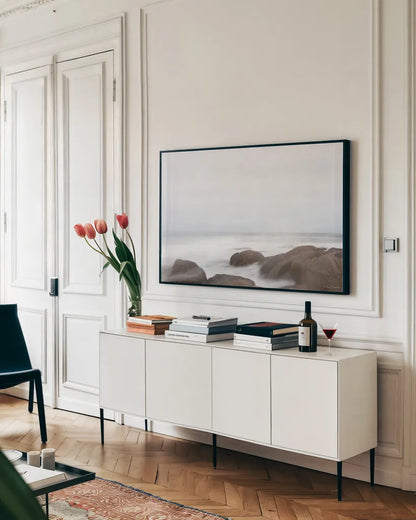 Misty Shore on the Rocks by Jocelyn Elizabeth. shown as a framed stretched canvas in a living room above a console. Available as a archival giclee rolled canvas, fine art paper, or poster print. SKU 100324i.