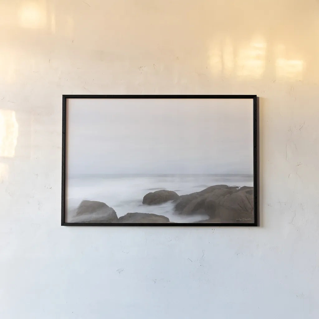 Misty Shore on the Rocks by Jocelyn Elizabeth. shown as a paper print in a black flame. Available as a archival giclee rolled canvas, fine art paper, or poster print. SKU 100324i.