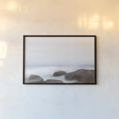 Misty Shore on the Rocks by Jocelyn Elizabeth. shown as a paper print in a black flame. Available as a archival giclee rolled canvas, fine art paper, or poster print. SKU 100324i.