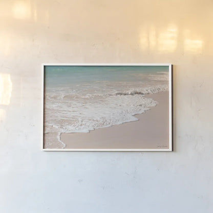Pink Sand Shoreline by Jocelyn Elizabeth. shown as a paper print in a white frame. Available as a archival giclee rolled canvas, fine art paper, or poster print. SKU 100325i.