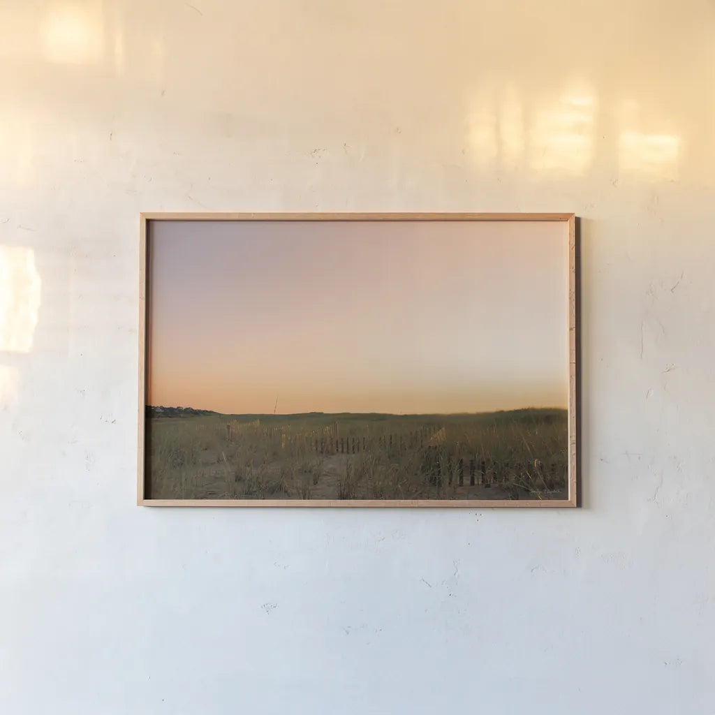 Sunrise over the Dunes by Jocelyn Elizabeth. shown as a paper print in a natural frame. Available as a archival giclee rolled canvas, fine art paper, or poster print. SKU 102107i.
