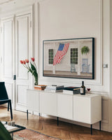 American Porch by Julia Purinton. shown as a framed stretched canvas in a living room above a console. Available as a archival giclee rolled canvas, fine art paper, or poster print. SKU 94437i.