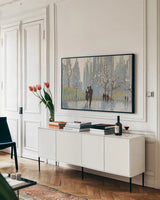 An Evening Out Blue by Julia Purinton. shown as a framed stretched canvas in a living room above a console. Available as a archival giclee rolled canvas, fine art paper, or poster print. SKU 37743i.
