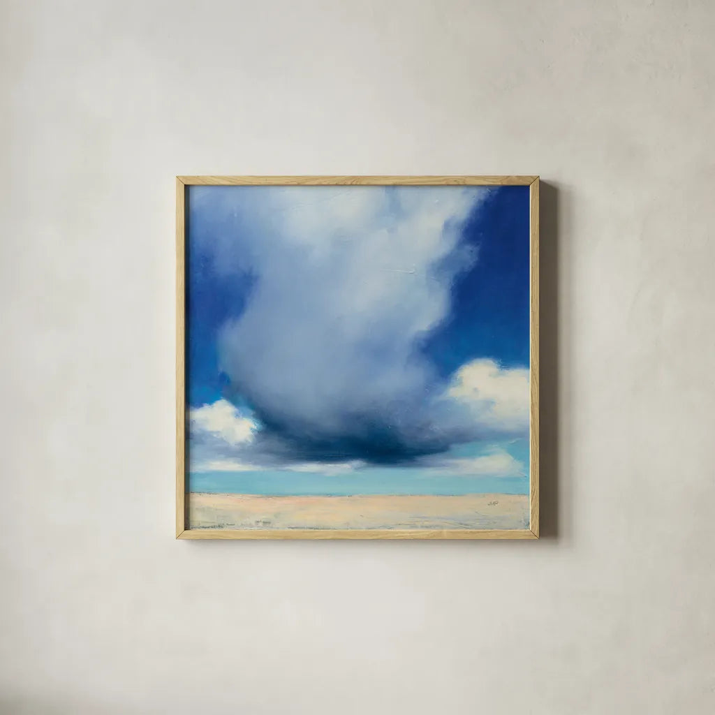 Beach Clouds I by Julia Purinton. Shown in a natural wood glass frame for a timeless modern aesthetic. Available as an archival giclee rolled canvas, fine art paper, or poster print. SKU 33435a.