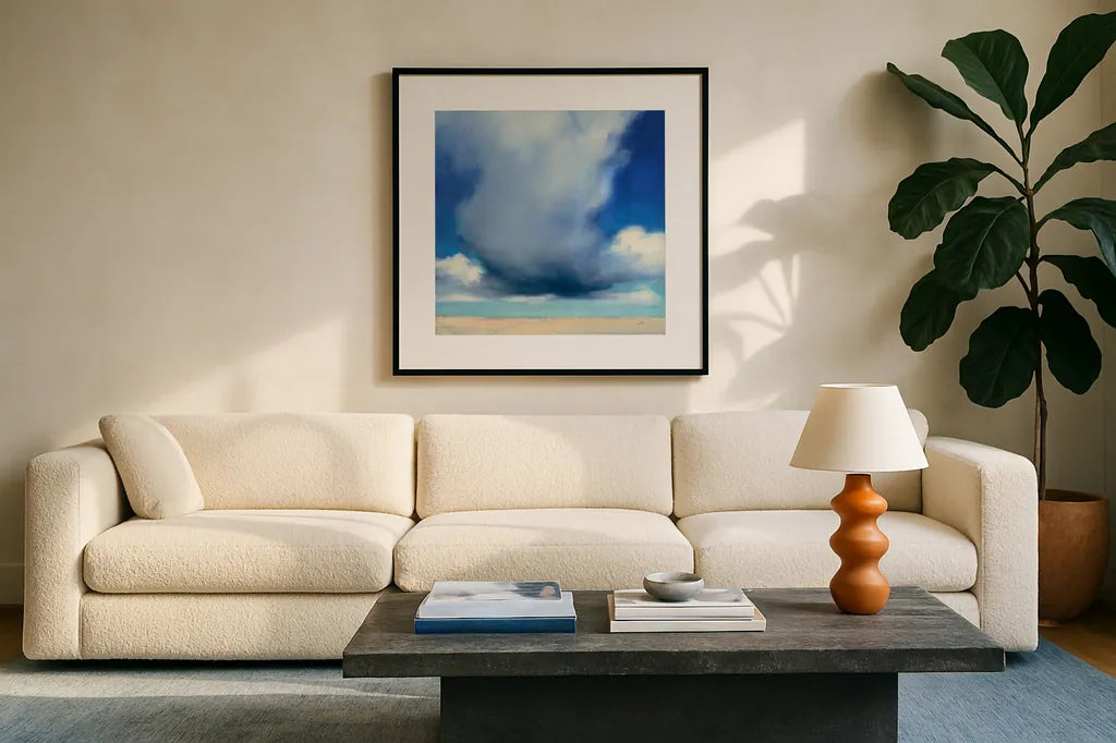 Beach Clouds I by Julia Purinton. Displayed in a glass frame with matte in a clean modern living room. Available as an archival giclee rolled canvas, fine art paper, or poster print. SKU 33435a.