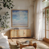 Beach Sky by Julia Purinton. Shown in a natural wood frame in a cozy modern living room. Available as an archival giclee rolled canvas, fine art paper, or poster print. SKU 73768a.