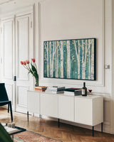 Birches in Spring by Julia Purinton. shown as a framed stretched canvas in a living room above a console. Available as a archival giclee rolled canvas, fine art paper, or poster print. SKU 21962i.