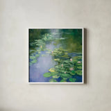 Blue Lily II by Julia Purinton. Shown in a crisp white glass frame for a clean and minimalist style. Available as an archival giclee rolled canvas, fine art paper, or poster print. SKU 22438a.