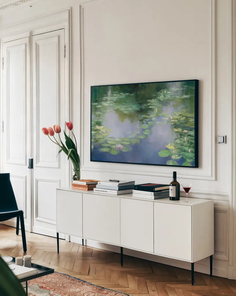 Blue Lily III by Julia Purinton. shown as a framed stretched canvas in a living room above a console. Available as a archival giclee rolled canvas, fine art paper, or poster print. SKU 22439i.