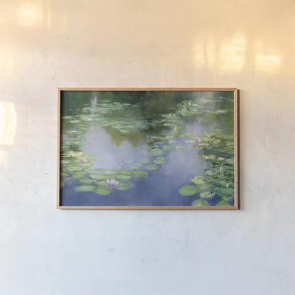Blue Lily III by Julia Purinton. shown as a paper print in a natural frame. Available as a archival giclee rolled canvas, fine art paper, or poster print. SKU 22439i.