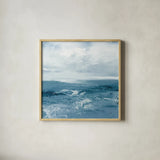 Blue Waves by Julia Purinton. Shown in a natural wood glass frame for a timeless modern aesthetic. Available as an archival giclee rolled canvas, fine art paper, or poster print. SKU 73108a.