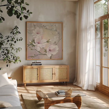 Blushing Magnolias by Julia Purinton. Shown in a natural wood frame in a cozy modern living room. Available as an archival giclee rolled canvas, fine art paper, or poster print. SKU 38369a.