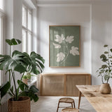 Botanical Study III Forest Green Crop by Julia Purinton. shown as a print in a natural wood frame in a dining room. Available as a archival giclee rolled canvas, fine art paper, or poster print. SKU 77829h.