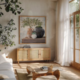 Calm Still Life Dark II by Julia Purinton. Shown in a natural wood frame in a cozy modern living room. Available as an archival giclee rolled canvas, fine art paper, or poster print. SKU 83019a.