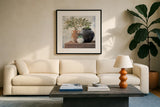 Calm Still Life Dark II by Julia Purinton. Displayed in a glass frame with matte in a clean modern living room. Available as an archival giclee rolled canvas, fine art paper, or poster print. SKU 83019a.