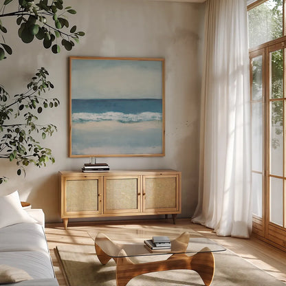 Calming Coast by Julia Purinton. Shown in a natural wood frame in a cozy modern living room. Available as an archival giclee rolled canvas, fine art paper, or poster print. SKU 86695a.