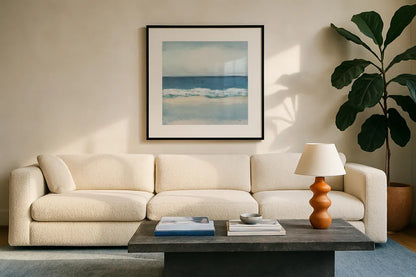 Calming Coast by Julia Purinton. Displayed in a glass frame with matte in a clean modern living room. Available as an archival giclee rolled canvas, fine art paper, or poster print. SKU 86695a.