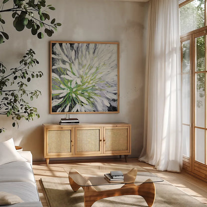 Cleome Splash II Black by Julia Purinton. Shown in a natural wood frame in a cozy modern living room. Available as an archival giclee rolled canvas, fine art paper, or poster print. SKU 56965a.