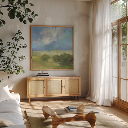 Clouds on the Mountain by Julia Purinton. Shown in a natural wood frame in a cozy modern living room. Available as an archival giclee rolled canvas, fine art paper, or poster print. SKU 77399a.