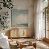 Colorful Horizon II Blue by Julia Purinton. Shown in a natural wood frame in a cozy modern living room. Available as an archival giclee rolled canvas, fine art paper, or poster print. SKU 82364a.