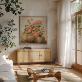 Cottage Geraniums III by Julia Purinton. Shown in a natural wood frame in a cozy modern living room. Available as an archival giclee rolled canvas, fine art paper, or poster print. SKU 81832a.