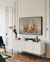 Cotton Still Life I Gray by Julia Purinton. shown as a framed stretched canvas in a living room above a console. Available as a archival giclee rolled canvas, fine art paper, or poster print. SKU 61132i.