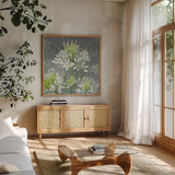 Farmhouse Cleome I by Julia Purinton. Shown in a natural wood frame in a cozy modern living room. Available as an archival giclee rolled canvas, fine art paper, or poster print. SKU 47857a.