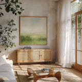 Fields of Green I by Julia Purinton. Shown in a natural wood frame in a cozy modern living room. Available as an archival giclee rolled canvas, fine art paper, or poster print. SKU 78365a.